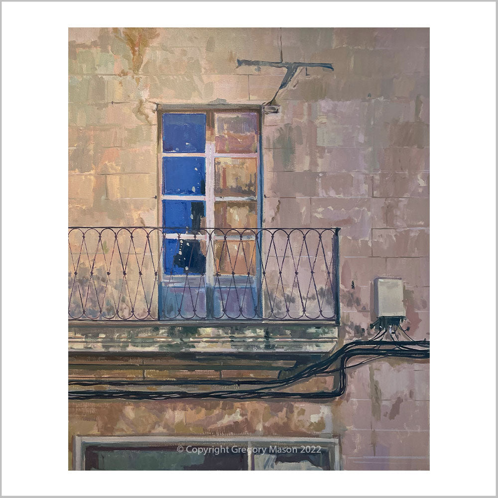 An original oil painting in the town of Pollenca in Mallorca showing the facade of an old building.